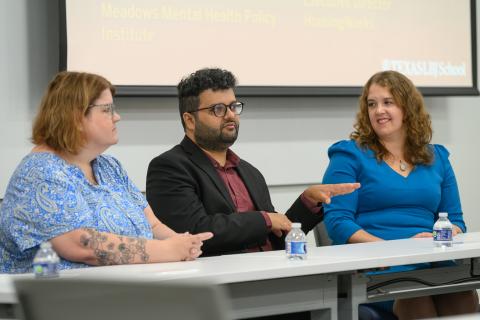 A photo of our three alum panelists. Awais Azhar is sitting in the middle and speaking.